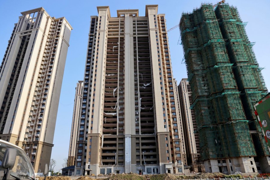 Residential buildings under construction are seen at Evergrande Cultural Tourism City, a project developed by China Evergrande Group, in Suzhou's Taicang, Jiangsu province, China September 23, 2021. REUTERS/Aly Song/File Photo