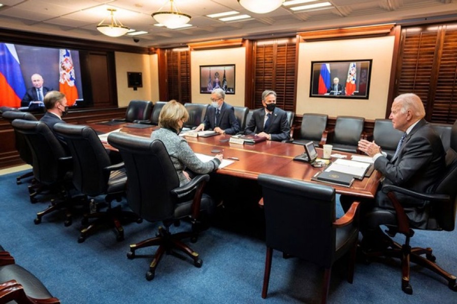 US President Joe Biden holds virtual talks with Russia's President Vladimir Putin amid Western fears that Moscow plans to attack Ukraine, as Secretary of State Antony Blinken listens with other officials during a secure video call from the Situation Room at the White House in Washington, US, Dec 7, 2021 – The White House/ Reuters