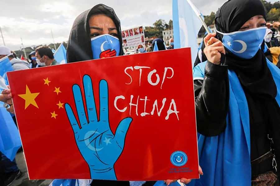 Ethnic Uyghur demonstrators taking part in a protest against China in Istanbul on October 1 -Reuters file photo