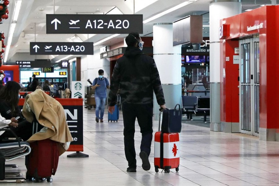 A United States-bound passenger walks in Toronto Pearson Airport's Terminal 3, days before new coronavirus disease (Covid-19) testing protocols to enter the US come into effect, in Toronto, Ontario, Canada on December 3, 2021 — Reuters/Files