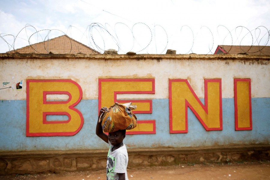 A Congolese boy walks past a wall in Beni, in the Democratic Republic of Congo on April 1, 2019 — Reuters/Files