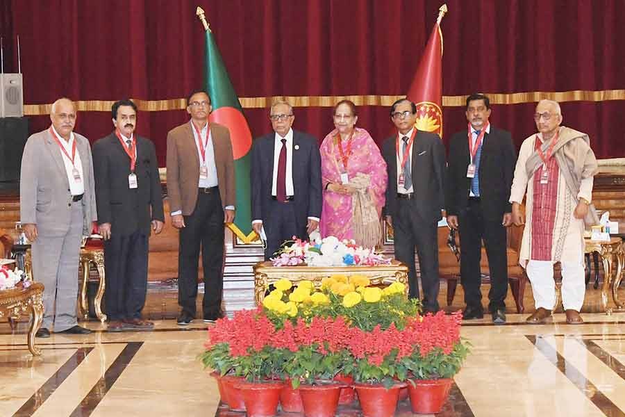 President Abdul Hamid, along with a delegation of Bangladesh National Awami Party (NAP), posing for photographs during a dialogue on the formation of the Election Commission on Sunday -PID Photo