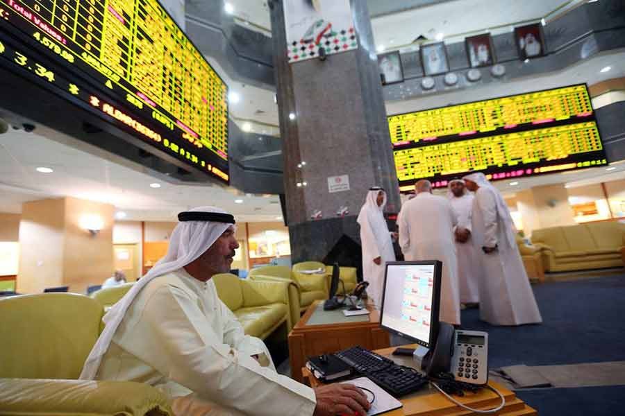 An investor monitoring a screen displaying stock information at the Abu Dhabi Securities Exchange -Reuters file photo