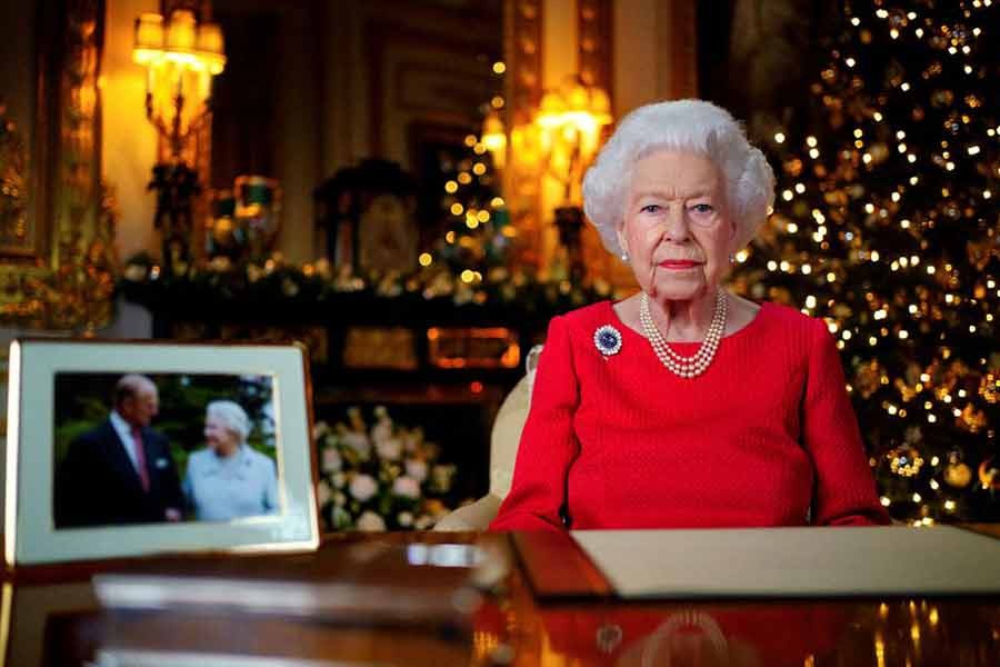 Britain's Queen Elizabeth recording her annual Christmas broadcast in the White Drawing Room in Windsor Castle, next to a photograph of the queen and the Duke of Edinburgh, in Windsor of Britain on December 23 this year -Reuters file photo