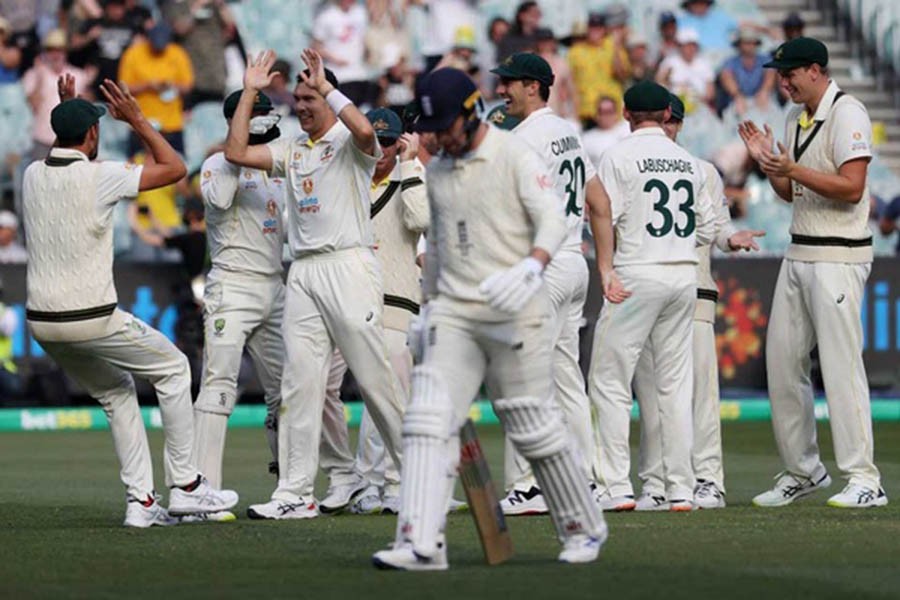 Cricket - Ashes - Third Test - Australia v England - Melbourne Cricket Ground, Melbourne, Australia - December 27, 2021 Australia's Scott Boland celebrates with teammates after taking the wicket of England's Jack Leach during day 2 of the Third Test Reuters