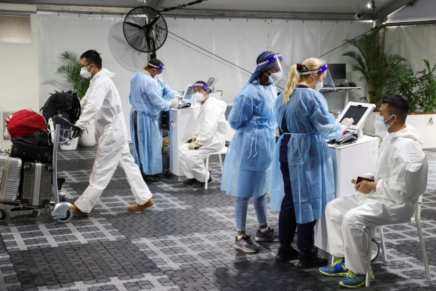 Travellers receive tests for the coronavirus disease (Covid-19) at a pre-departure testing facility, as countries react to the new coronavirus Omicron variant, outside the international terminal at Sydney Airport in Sydney, Australia on November 29, 2021 — Reuters/Files