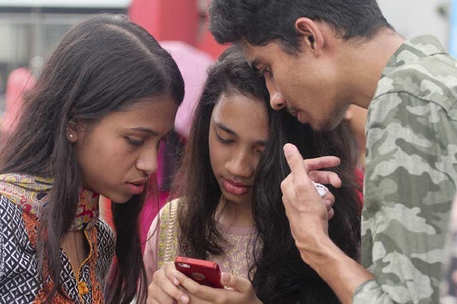 Students at a school in Dhaka using smartphones to check their SSC exam results — File photo