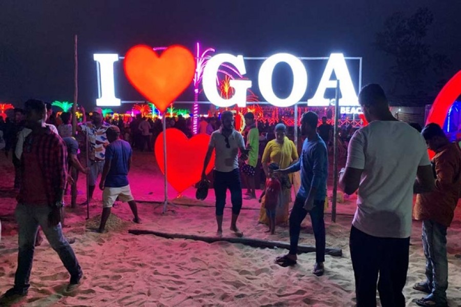 People visit Calangute Beach during the ongoing coronavirus disease (COVID-19) pandemic, in the western state of Goa, India, December 30, 2021 – Reuters