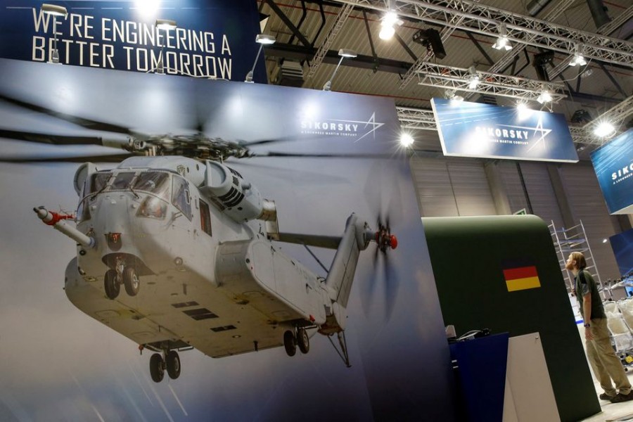 A photograph of a CH-53 helicopter is pictured at the booth of Sikorsky - Lockheed Martin company during preparation for the ILA Berlin Air Show in Schoenefeld, south of Berlin, Germany, May 31, 2016. REUTERS/Fabrizio Bensch/File Photo