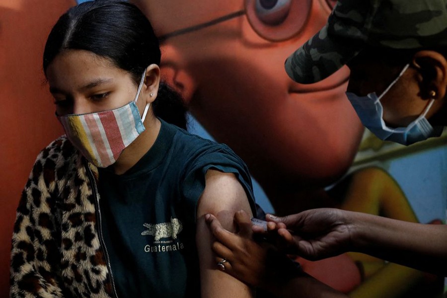 A girl receives a dose of the COVAXIN coronavirus disease (Covid-19) vaccine manufactured by Bharat Biotech, during a vaccination drive for children aged 15-18 in New Delhi, India on January 3, 2022 — Reuters photo