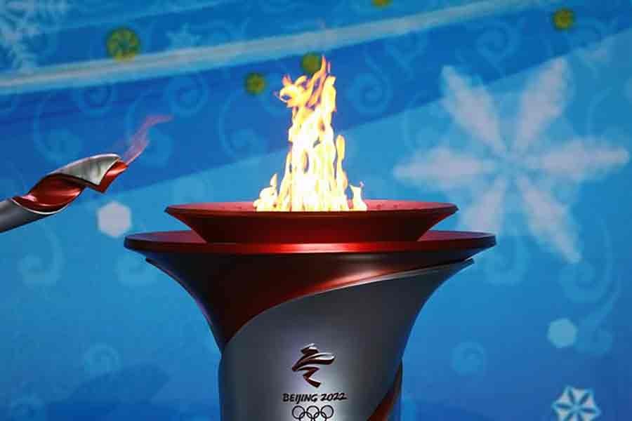 The Olympic flame is transferred from a torch to a cauldron at the ceremony to welcome the flame for the Beijing 2022 Winter Olympics in Beijing on October 20 last year -Reuters file photo