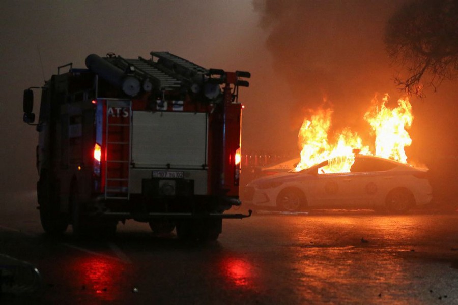 A view shows a burning police car during a protest against LPG cost rise following the Kazakh authorities' decision to lift price caps on liquefied petroleum gas in Almaty, Kazakhstan on January 5, 2022 — Reuters photo