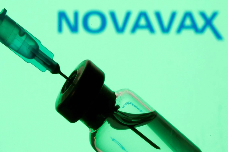 A vial and sryinge are seen in front of a displayed Novavax logo in this illustration taken January 11, 2021. REUTERS/Dado Ruvic/Illustration