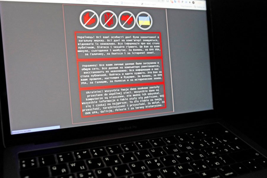 A laptop screen displays a warning message in Ukrainian, Russian and Polish, that appeared on the official website of the Ukrainian Foreign Ministry after a massive cyberattack, in this illustration taken January 14, 2022. REUTERS