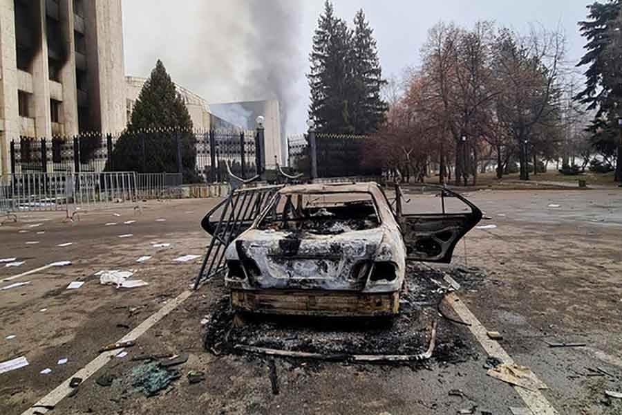 A view showing a burnt vehicle near the mayor's office building in Almaty of Kazakhstan on January 6 following the protests triggered by a fuel price increase -Reuters file photo