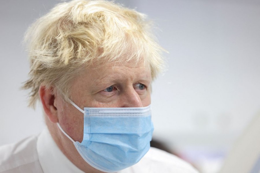 Britain's Prime Minister Boris Johnson visits Finchley Memorial Hospital, an NHS (National Health Service) community hospital, in North London, Britain January 18, 2022. Ian Vogler/Pool via REUTERS