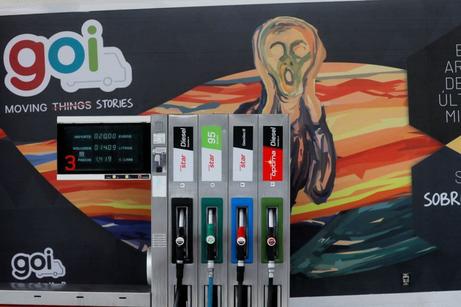 A GOI company truck is seen next to fuel pumps at a Cepsa petrol station in Cuevas del Becerro, Spain, November 29, 2021. REUTERS/Jon Nazca/File Photo