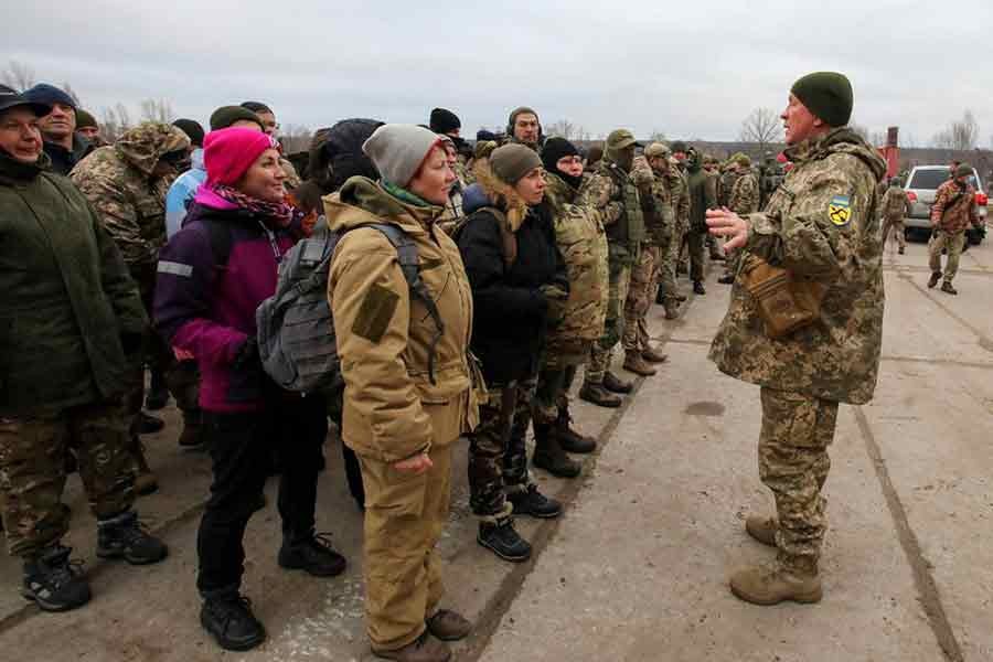 Reservists of the Ukrainian Territorial Defence Forces listening to instructions during military exercises at a training ground outside Kharkiv of Ukraine on December 11 last year –Reuters file photo