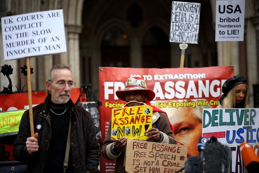 Supporters of WikiLeaks founder Julian Assange protest outside the Royal Courts of Justice in London, Britain, January 24, 2022. REUTERS/Henry Nicholls