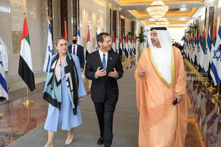 Israeli President Isaac Herzog and Foreign Minister of the United Arab Emirates, Sheikh Abdullah bin Zayed Al Nahyan, talk as they walk through an airport in Abu Dhabi, United Arab Emirates January 30, 2022. (Reuters)