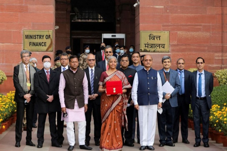 India's Finance Minister Nirmala Sitharaman holds up a folder with the Government of India’s logo as she leaves her office to present the federal budget in the parliament in New Delhi, India, Feb 1, 2022 – Reuters