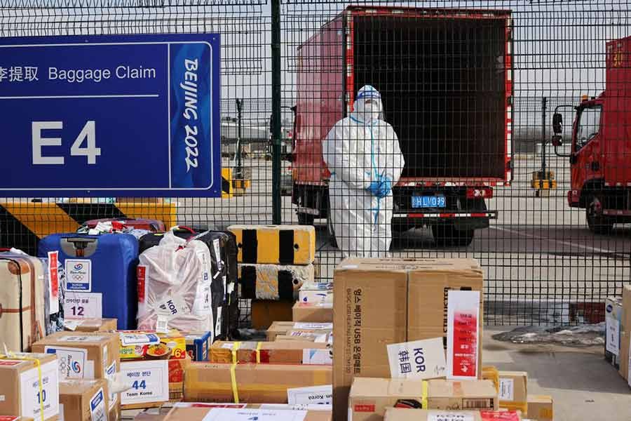 A staff member standing behind baggage claim zone at Beijing Capital International Airport in Beijing on January 31 this year ahead of the Beijing 2022 Winter Olympics –Reuters file photo