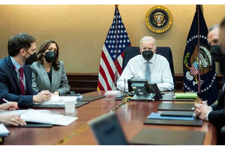 US President Joe Biden, Vice President Kamala Harris and other White House national security staff are seen in a White House handout photo watching the US Special Forces operation in Northern Syria against ISIS leader Abu Ibrahim al-Hashemi al-Quraishi from the Situation Room at the White House in Washington, US, Feb 3, 2022. The White House/ REUTERS