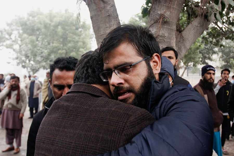 Relatives of Captain Bilal Khalil, who was killed along with others in an attack on a military base in Nushki, comforting each other during his funeral in Faisalabad of Pakistan on February 4 this year –Reuters file photo