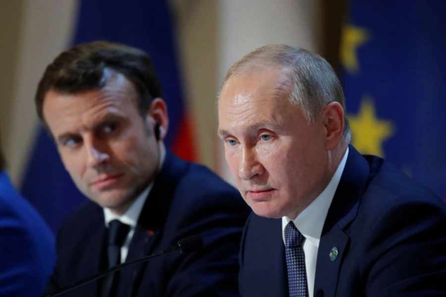 French President Emmanuel Macron and Russia's President Vladimir Putin attending a joint news conference after a Normandy-format summit in Paris on December 9 in 2019 –Reuters file photo