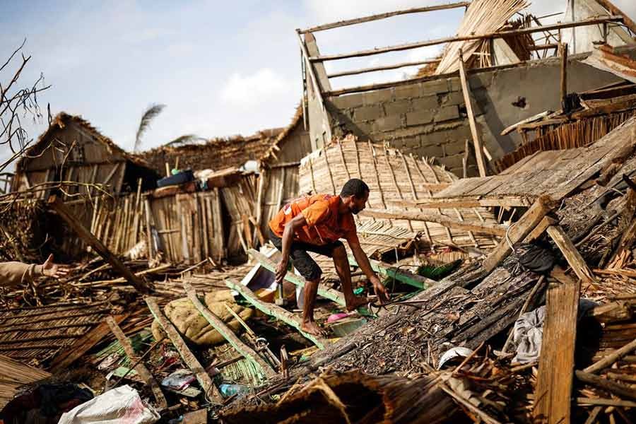 A man working on the destroyed house of Philibert Jean Claude Razananoro, in the aftermath of Cyclone Batsirai, in the town of Mananjary of Madagascar on Tuesday –Reuters photo