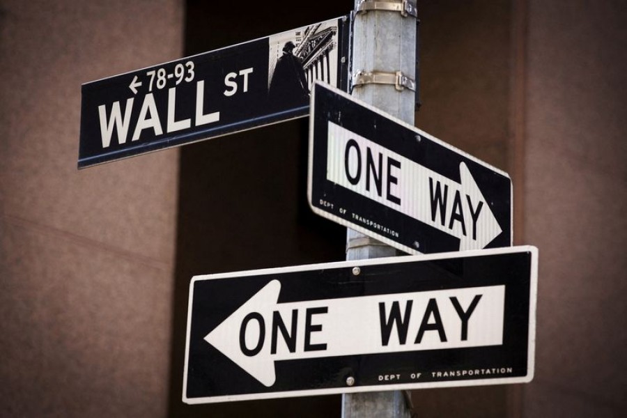 A 'Wall St' sign is seen above two 'One Way' signs in New York August 24, 2015 — Reuters/Lucas Jackson/File Photo