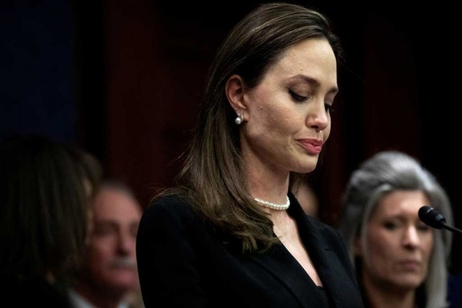 Actor Angelina Jolie speaks beside members of Congress on the Violence Against Women Act, on Capitol