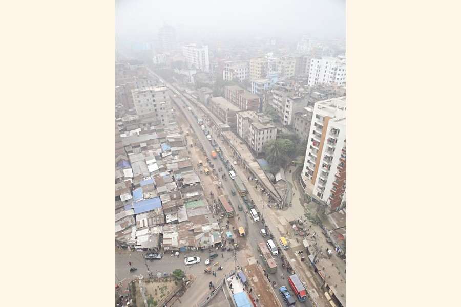 A thick blanket of fog enveloped the entire Dhaka city throughout the day on Thursday. The aerial shot was taken from the Chankharpool area in the city around noon — FE photo by Shafiqul Alam