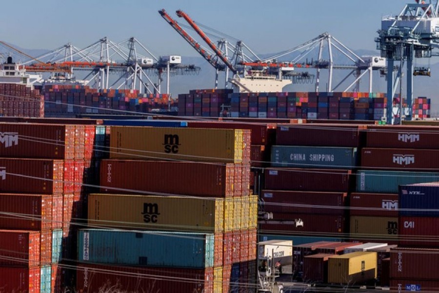 Stacked containers are shown as ships unload their cargo at the Port of Los Angeles in Los Angeles, California, US, Nov 22, 2021 – Reuters/Mike Blake