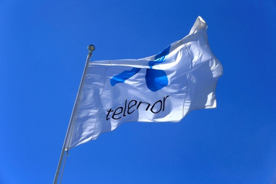 Telenor flag flutters next to the company's headquarters in Fornebu, Norway, June 1, 2017 –Reuters/Ints Kalnins//File Photo