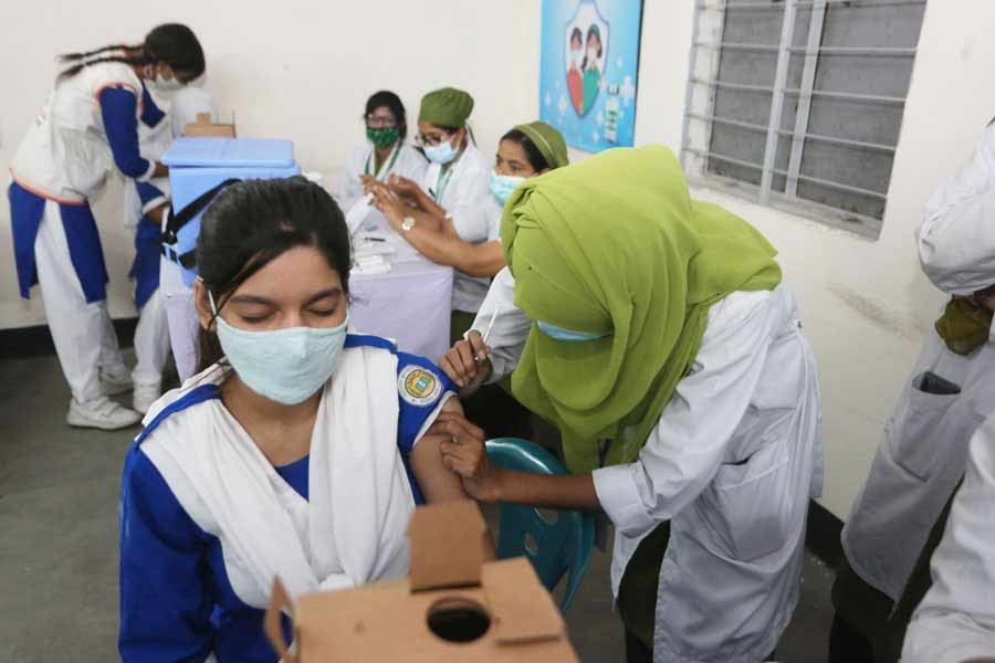 A schoolgirl receiving Covid-19 vaccine in Dhaka —FE file photo