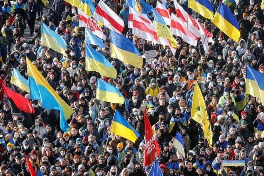 People take part in the Unity March, which is a procession to demonstrate Ukrainians' patriotic spirit amid growing tensions with Russia, in Kyiv, Ukraine February 12, 2022. REUTERS/Valentyn Ogirenko