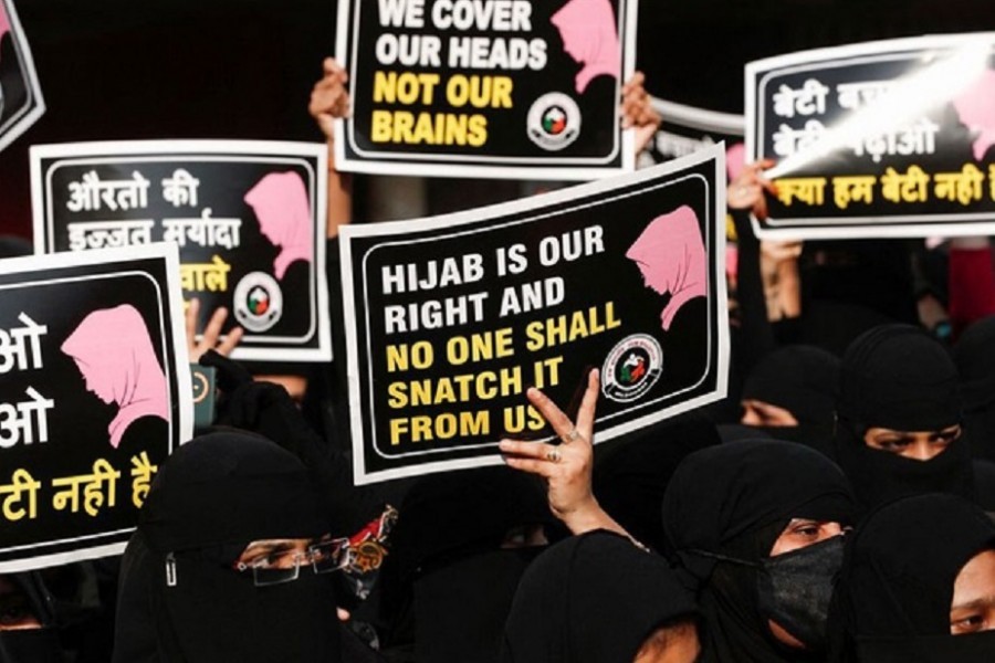 Women hold placards during a protest, organised by Hum Bhartiya, against the recent hijab ban in few colleges of Karnataka state, on the outskirts of Mumbai, India, Feb 11, 2022 – Reuters/Files