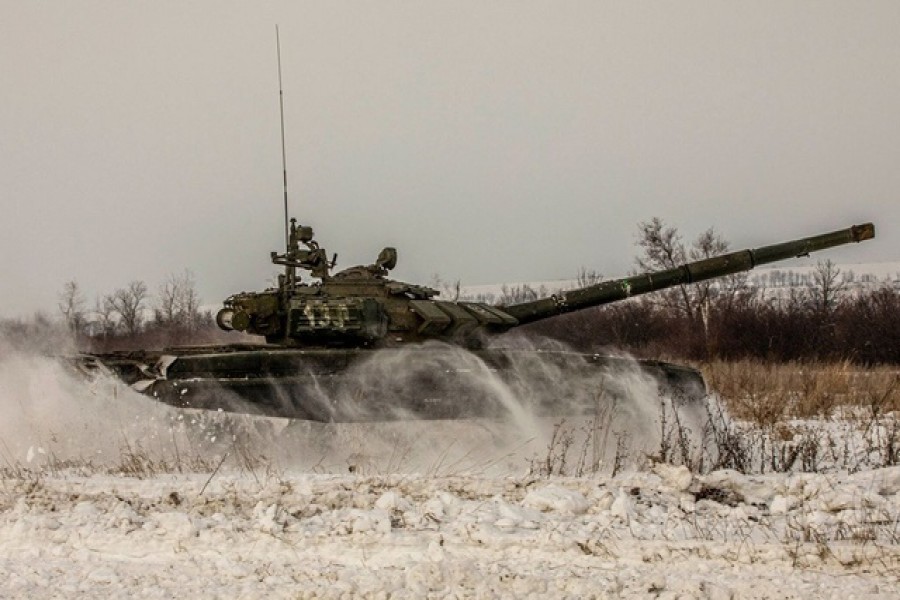 A tank of Russian armed forces drives during military exercises in the Leningrad Region, Russia, in this handout picture released February 14, 2022. Russian Defence Ministry via REUTERS