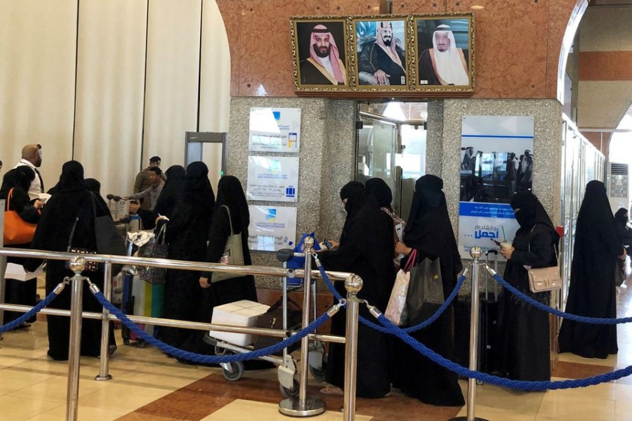 Saudi women are seen in line as they are traveling at the Dammam railway station in Dammam, Saudi Arabia, August 21, 2019. REUTERS/ Hamad I Mohammed