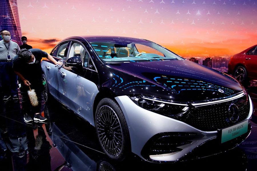 A staff member cleaning a Mercedes-Benz EQS 580 4MATIC electric vehicle during a media day for the Auto Shanghai show in Shanghai of China on April 19 last year –Reuters file photo