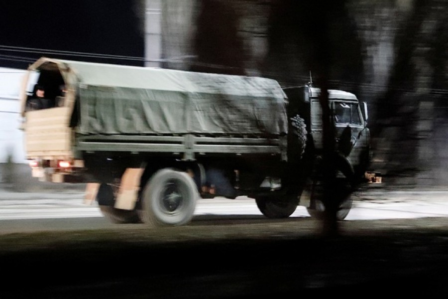 A military truck drives along a street after Russian President Vladimir Putin ordered the deployment of Russian troops to two breakaway regions in eastern Ukraine following the recognition of their independence, in the separatist-controlled city of Donetsk, Ukraine Feb 22, 2022 — Reuters/Alexander Ermochenko