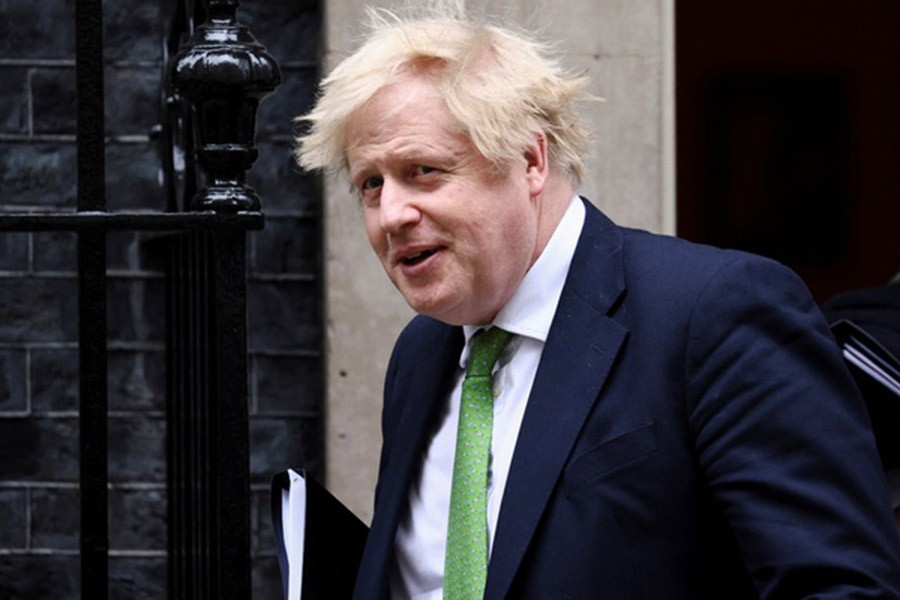 British Prime Minister Boris Johnson walks outside Downing Street, in London, Britain February 22, 2022. REUTERS/Henry Nicholls