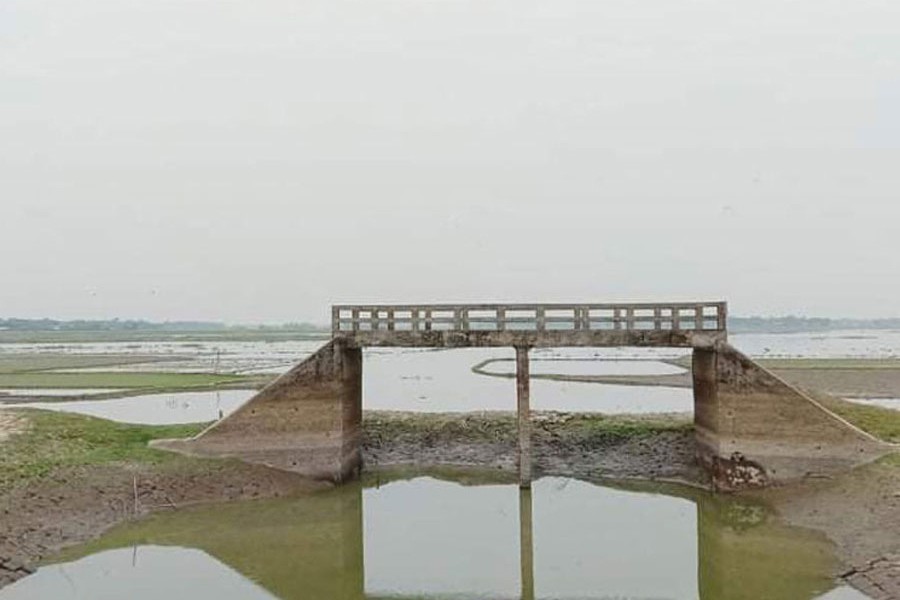 A bridge constructed over the Khuraikhali canal in Madan upazila of Netrakona district has no approach road — FE Photo