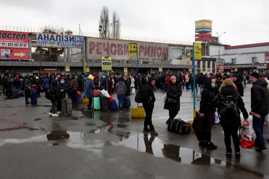 People gather at a bus station as they try to leave the city of Kyiv, Ukraine. (Reuters)