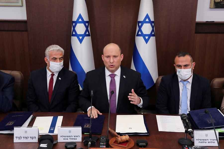 Israeli Prime Minister Naftali Bennett, Foreign Minister Yair Lapid and Government Secretary Shalom Shlomo attending a cabinet meeting at the Prime Minister's office in Jerusalem on Sunday –Reuters photo