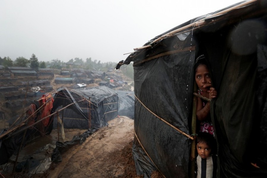 Rohingya refugees look out from a shelter in Cox's Bazar — Reuters/Files