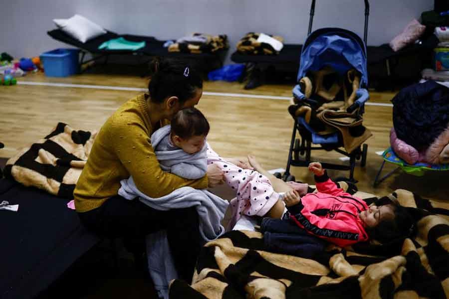 A woman with her two children, who have fled the Russian invasion of Ukraine, staying at a shelter centre in Poland on Tuesday –Reuters photo