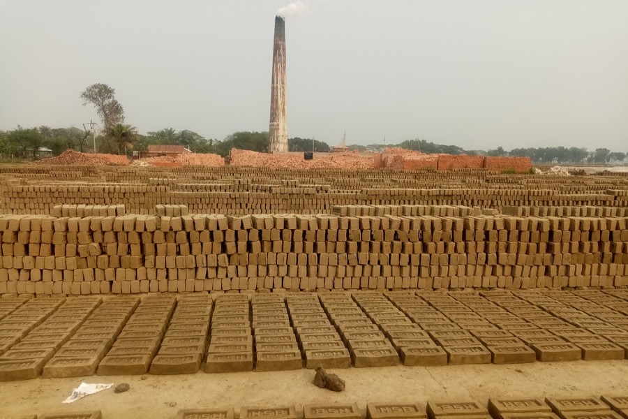 A brickfield in Kandiura union of Netrakona's Kendua upazila operating beside a cropfield — FE Photo