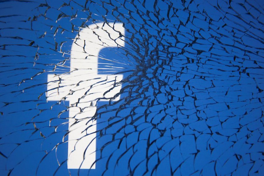 Facebook logo is displayed through broken glass in this illustration taken on October 4, 2021 — Reuters/Files